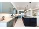 Modern kitchen with sleek cabinets, stainless steel appliances, and ample counter space at 43010 Ptarmigan Ranch St, Parker, CO 80138
