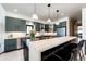 Stylish kitchen features a breakfast bar, stainless steel appliances, and ample counter space at 43010 Ptarmigan Ranch St, Parker, CO 80138