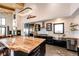 Spacious open kitchen featuring a large island, stainless steel appliances, and modern cabinetry at 43010 Ptarmigan Ranch St, Parker, CO 80138
