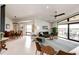 Spacious living room with dining area features modern decor and great natural light at 43010 Ptarmigan Ranch St, Parker, CO 80138