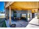 Outdoor covered patio with seating area, wood ceiling, and landscape views at 43010 Ptarmigan Ranch St, Parker, CO 80138