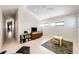 Bright playroom with a TV, ample natural light from windows, and a ceiling fan at 43010 Ptarmigan Ranch St, Parker, CO 80138