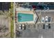 Aerial view of a community pool, and a parking lot at a high-rise building at 800 N Washington St # 804, Denver, CO 80203
