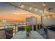 Balcony with outdoor seating features beautiful sunset views and string lighting at 800 N Washington St # 804, Denver, CO 80203