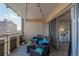 Condo balcony with an outdoor lounge and views into the interior bedroom of the home at 800 N Washington St # 804, Denver, CO 80203