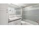 Tidy bathroom with white cabinets, a vanity mirror, and a sliding glass door shower at 800 N Washington St # 804, Denver, CO 80203
