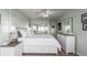 Comfortable bedroom features white furniture, stylish decor, and lots of natural light at 800 N Washington St # 804, Denver, CO 80203