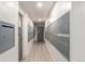 Interior hallway lined with mailboxes, showcasing clean lines and neutral tones with tile floors, and a secure door at 800 N Washington St # 804, Denver, CO 80203