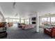 Open-concept living room with fireplace, ample seating, and city views at 800 N Washington St # 804, Denver, CO 80203