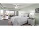 Relaxing main bedroom featuring soft green walls, ample natural light, and a ceiling fan at 800 N Washington St # 804, Denver, CO 80203