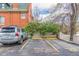 Reserved parking spot in front of a vintage brick building at 800 N Washington St # 804, Denver, CO 80203