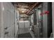 Unfinished basement with a furnace, water heater, and laundry area at 6625 W 84Th Cir # 48, Arvada, CO 80003