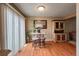 A cute dining area features bright light, wood floors, and a hutch at 6625 W 84Th Cir # 48, Arvada, CO 80003