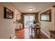 The dining room has hardwood floors and an adjacent sliding glass door at 6625 W 84Th Cir # 48, Arvada, CO 80003