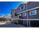 A view of the townhome with private balconies and garages at 6625 W 84Th Cir # 48, Arvada, CO 80003