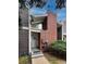 Entry to townhome with updated siding and brick chimney at 6625 W 84Th Cir # 48, Arvada, CO 80003