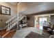 Comfortable living room with carpet, staircase and view into dining area at 6625 W 84Th Cir # 48, Arvada, CO 80003