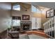 Inviting living room with a cozy stone fireplace and vaulted ceilings at 6625 W 84Th Cir # 48, Arvada, CO 80003