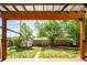 View of a backyard with a deck, swing set, storage shed, and a wooden fence at 1735 S Wyandot St, Denver, CO 80223
