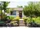Charming home featuring a cozy entrance with well-kept landscaping and inviting front steps at 1735 S Wyandot St, Denver, CO 80223
