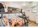 Bright bedroom with colorful bunkbeds and wood laminate flooring at 1271 Uinta St, Denver, CO 80220