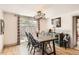 Elegant dining room with stylish lighting fixture and access to outdoor area at 1271 Uinta St, Denver, CO 80220