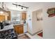 Charming kitchen features granite countertops and stainless steel appliances at 1271 Uinta St, Denver, CO 80220