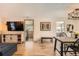 Spacious living area with hardwood floors connecting to sunroom and dining space at 1271 Uinta St, Denver, CO 80220