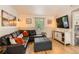 Comfortable living room with stylish decor, hardwood floors, and ample seating at 1271 Uinta St, Denver, CO 80220