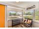 Bright sunroom featuring large windows with views, hardwood floors, and mountain decor at 1271 Uinta St, Denver, CO 80220