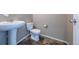 Powder bath featuring a pedestal sink, toilet, and neutral walls at 19347 E 65Th Ave, Aurora, CO 80019