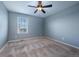Carpeted bedroom with ceiling fan and window with blinds at 19347 E 65Th Ave, Aurora, CO 80019