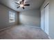 Neutral bedroom features carpet, a ceiling fan, closet doors and a window with blinds at 19347 E 65Th Ave, Aurora, CO 80019