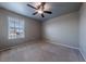 Bedroom features carpet, a ceiling fan, and a window with blinds at 19347 E 65Th Ave, Aurora, CO 80019