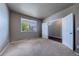 Neutral bedroom with carpet, closet, and a window offering natural light at 19347 E 65Th Ave, Aurora, CO 80019