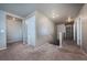 Upstairs hallway featuring neutral walls, carpeted flooring, and bright, recessed lighting at 19347 E 65Th Ave, Aurora, CO 80019