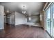 Spacious living room featuring hardwood floors, natural light, and access to the backyard deck at 19347 E 65Th Ave, Aurora, CO 80019