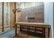 A basement workshop with a wooden workbench and pegboard is perfect for all your projects at 19347 E 65Th Ave, Aurora, CO 80019
