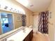 Bathroom with a shower/tub combo, toilet, and vanity at 8430 Little Rock Way # 102, Highlands Ranch, CO 80126