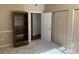 Bedroom featuring multiple closets, neutral carpet, and a decorative bookshelf at 8430 Little Rock Way # 102, Highlands Ranch, CO 80126