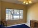 Bedroom with a window, dresser, globe, and blue bed at 8430 Little Rock Way # 102, Highlands Ranch, CO 80126