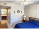 Bedroom with a blue bed and attached bathroom at 8430 Little Rock Way # 102, Highlands Ranch, CO 80126