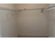 Walk-in closet with shelving and hanging bar at 8430 Little Rock Way # 102, Highlands Ranch, CO 80126