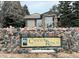 Canyon Ranch community sign on a stone wall, framed by pine trees and showcasing the neighborhood's branding at 8430 Little Rock Way # 102, Highlands Ranch, CO 80126