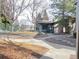 A community pool area with a gated fence, surrounded by mature trees and meticulous landscaping at 8430 Little Rock Way # 102, Highlands Ranch, CO 80126