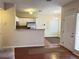 Open floor plan showing the kitchen and living room areas with ample natural light and neutral color scheme at 8430 Little Rock Way # 102, Highlands Ranch, CO 80126