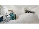 Spacious carpeted basement featuring bright white walls and abundant natural light from multiple windows at 11880 W 30Th Pl, Lakewood, CO 80215