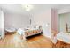 Charming bedroom with hardwood floors, unique decor, and natural light at 11880 W 30Th Pl, Lakewood, CO 80215