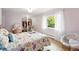 Lovely bedroom features a walk-in closet, soft lighting, and hardwood floors at 11880 W 30Th Pl, Lakewood, CO 80215