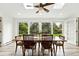 Dining room with large windows that brighten room and feature wooden table and seating at 11880 W 30Th Pl, Lakewood, CO 80215